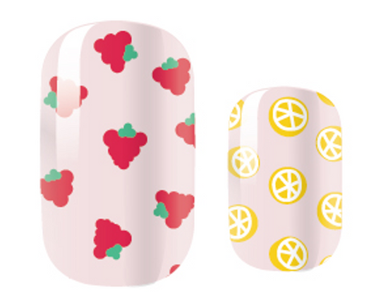 Pink nail wraps with red strawberry and yellow lemon slice patterns